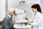 Optician checking patient diopter and eyesight problems.
