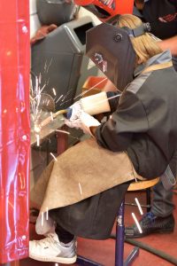 Woman working as a welder