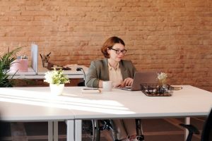 woman with physical disability working in the office